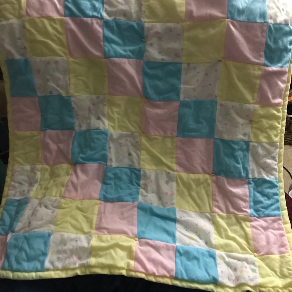 Hand made quilt. Fits s baby bed.